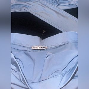Fashion nova club set baby blue , crossed back, mini skirt